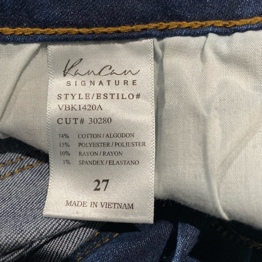 Distressed with patches of dark denim behind